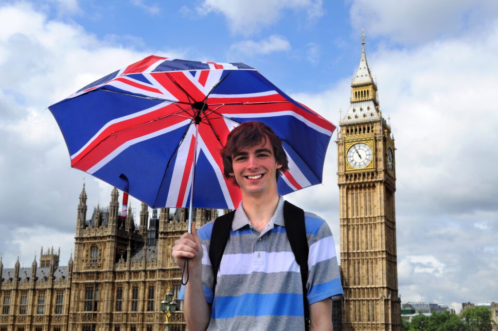 young boy holding UK flag