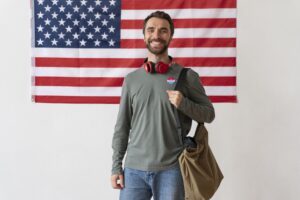 A student standing with handbag 